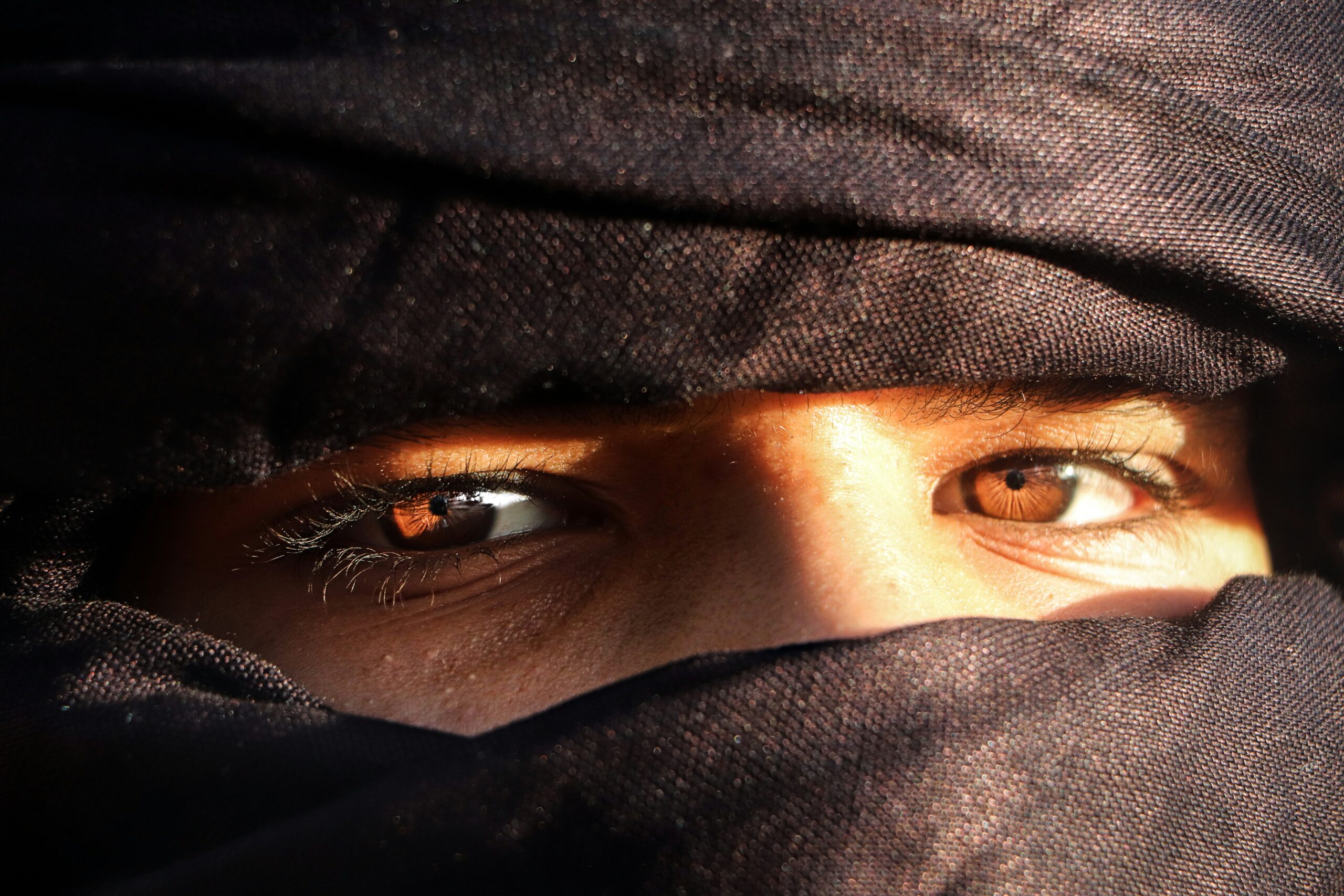 Woman walking in Marrakech market, Morocco